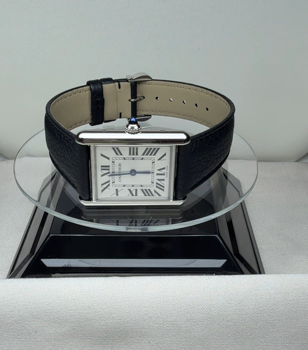 Cartier Tank in size L with a white dial and Roman numerals, front view