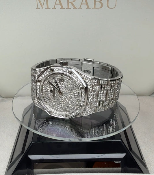 Audemars Piguet Royal Oak fully set with diamonds, angled view on a display stand